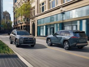 Toyota RAV4 driving on a city street, passing by another RAV4.