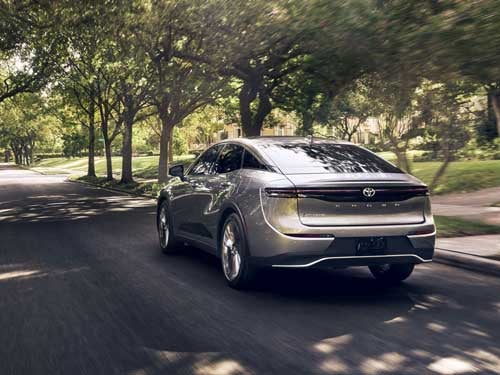 2024 Toyota Crown driving down a road