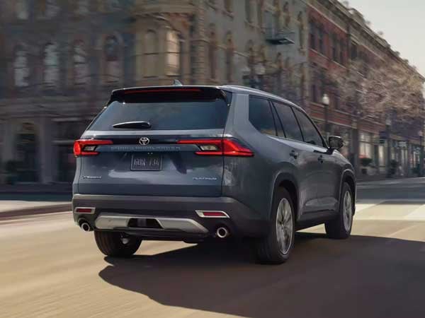 2025 Grand Highlander Hybrid driving on a road