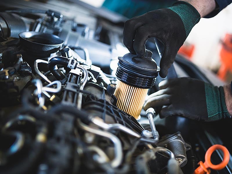Fuel filter being replaced in a service center.