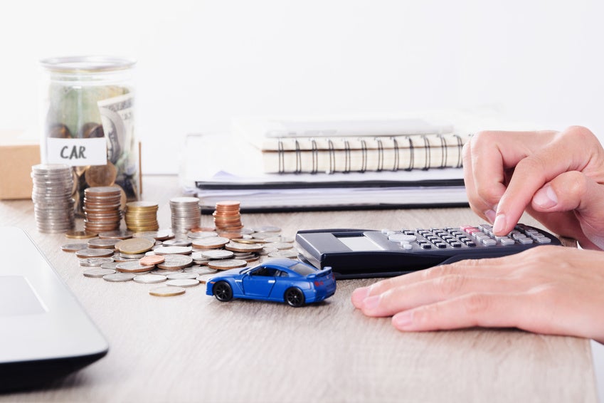 Person calculating Nissan financing payments